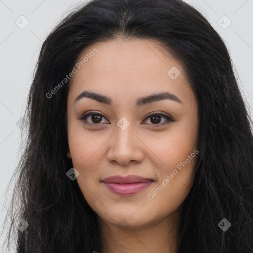 Joyful asian young-adult female with long  brown hair and brown eyes