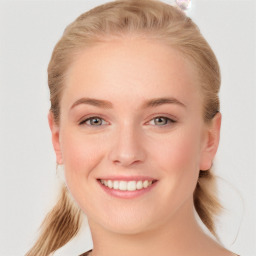 Joyful white young-adult female with long  brown hair and blue eyes