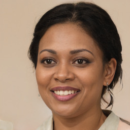 Joyful white adult female with medium  brown hair and brown eyes