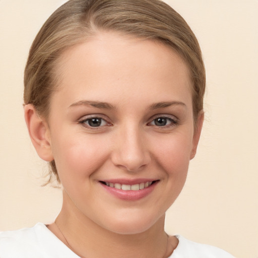 Joyful white child female with medium  brown hair and brown eyes