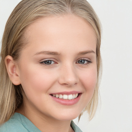 Joyful white child female with long  brown hair and blue eyes