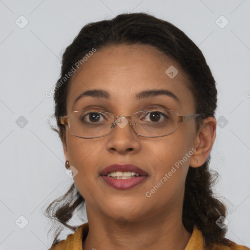 Joyful black adult female with medium  brown hair and brown eyes