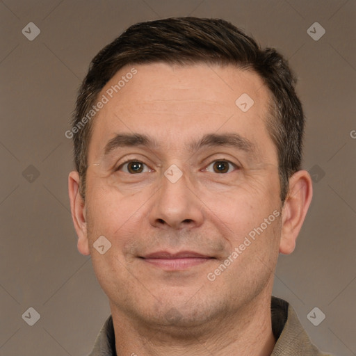 Joyful white adult male with short  brown hair and brown eyes