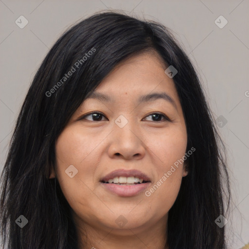 Joyful asian young-adult female with long  brown hair and brown eyes