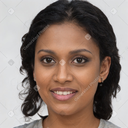 Joyful black young-adult female with medium  brown hair and brown eyes