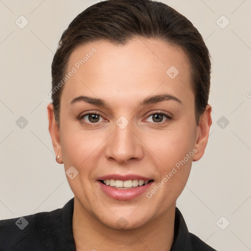 Joyful white young-adult female with short  brown hair and brown eyes