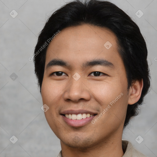 Joyful asian young-adult male with short  black hair and brown eyes