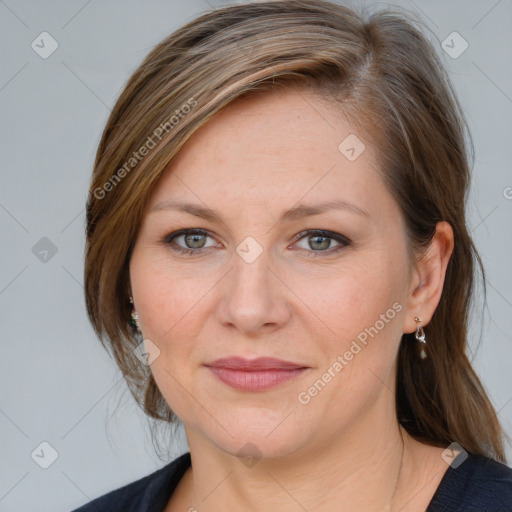 Joyful white adult female with medium  brown hair and blue eyes