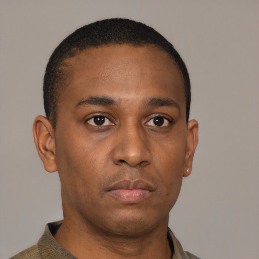 Neutral latino young-adult male with short  brown hair and brown eyes