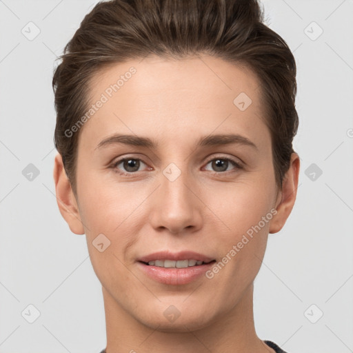 Joyful white young-adult female with short  brown hair and grey eyes