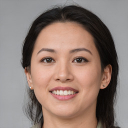 Joyful white young-adult female with medium  brown hair and brown eyes