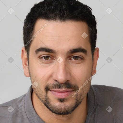 Joyful white young-adult male with short  black hair and brown eyes