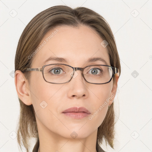 Joyful white adult female with medium  brown hair and blue eyes