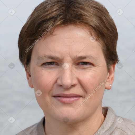 Joyful white adult female with short  brown hair and grey eyes