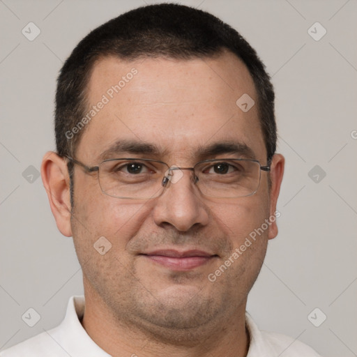 Joyful white adult male with short  brown hair and brown eyes