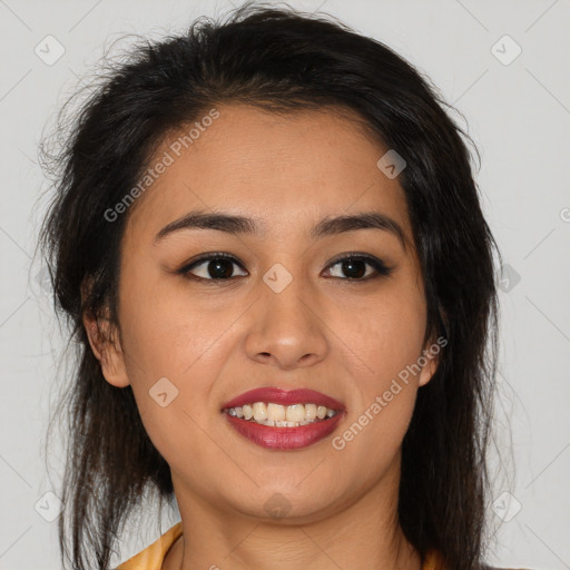 Joyful latino young-adult female with medium  brown hair and brown eyes