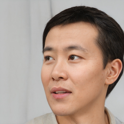 Neutral asian young-adult male with short  black hair and brown eyes