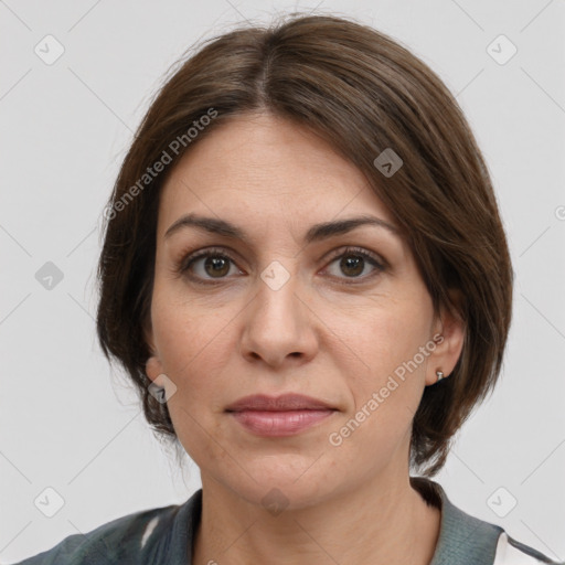 Joyful white adult female with medium  brown hair and grey eyes