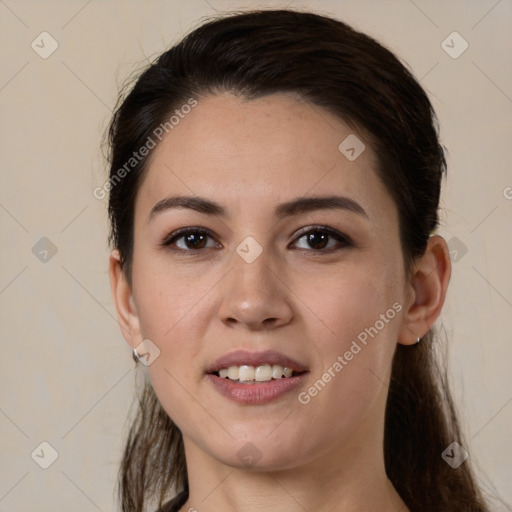 Joyful white young-adult female with long  brown hair and brown eyes