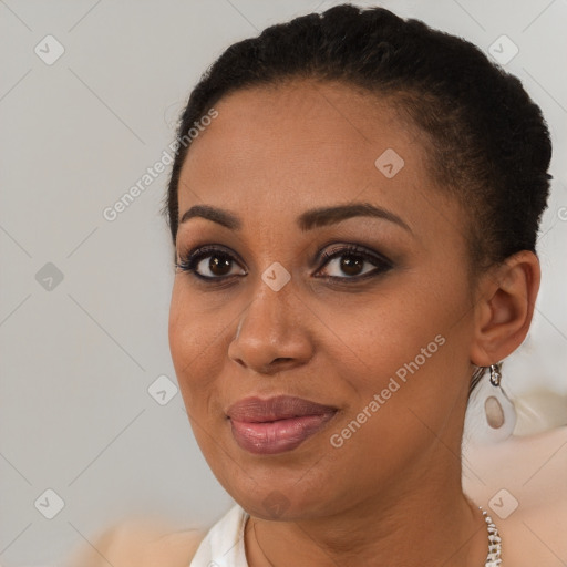 Joyful black young-adult female with short  brown hair and brown eyes