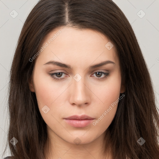 Neutral white young-adult female with long  brown hair and brown eyes