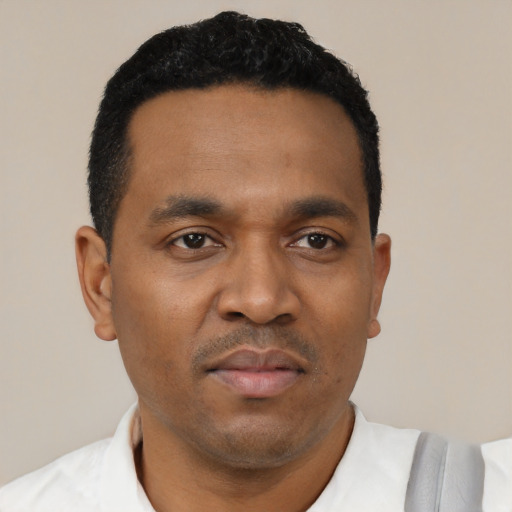 Neutral black young-adult male with short  black hair and brown eyes
