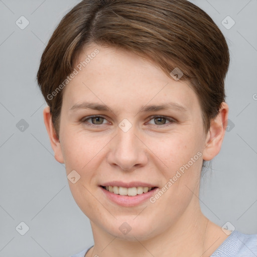 Joyful white young-adult female with short  brown hair and grey eyes