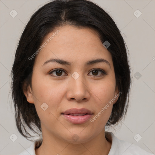 Joyful latino young-adult female with medium  brown hair and brown eyes