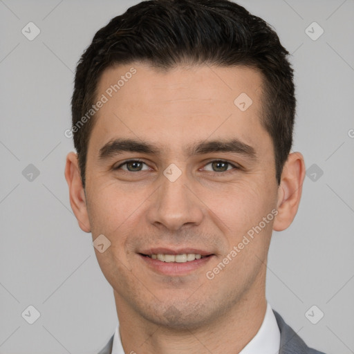 Joyful white young-adult male with short  brown hair and brown eyes