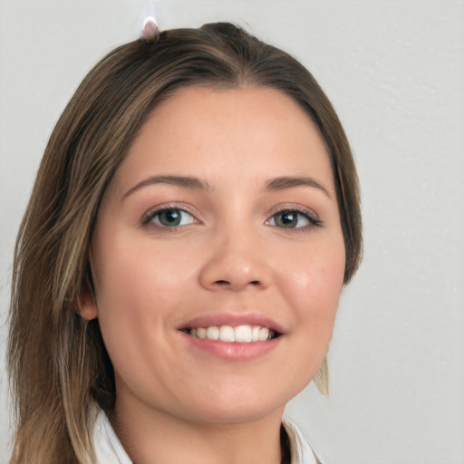 Joyful white young-adult female with medium  brown hair and blue eyes