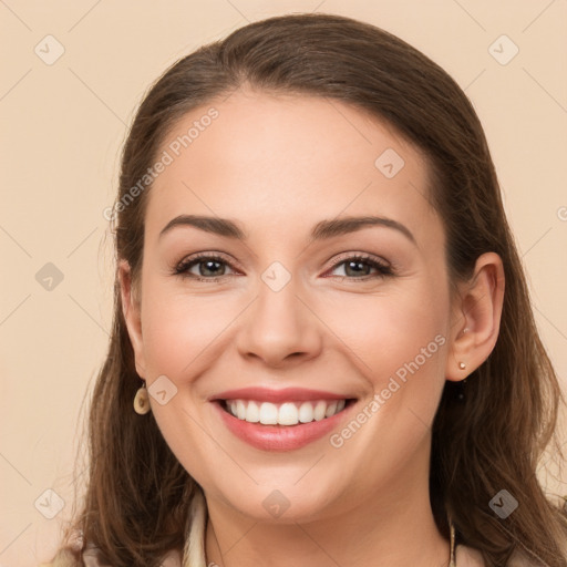 Joyful white young-adult female with long  brown hair and grey eyes