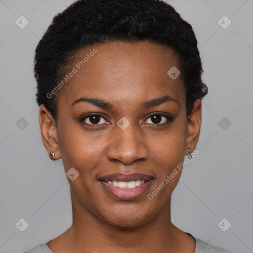 Joyful black young-adult female with short  black hair and brown eyes