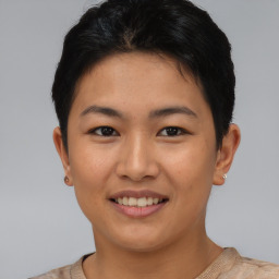 Joyful asian young-adult female with short  black hair and brown eyes