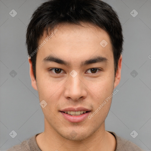 Joyful asian young-adult male with short  brown hair and brown eyes