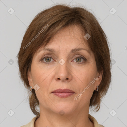 Joyful white adult female with medium  brown hair and grey eyes