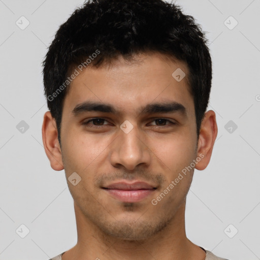 Joyful latino young-adult male with short  brown hair and brown eyes