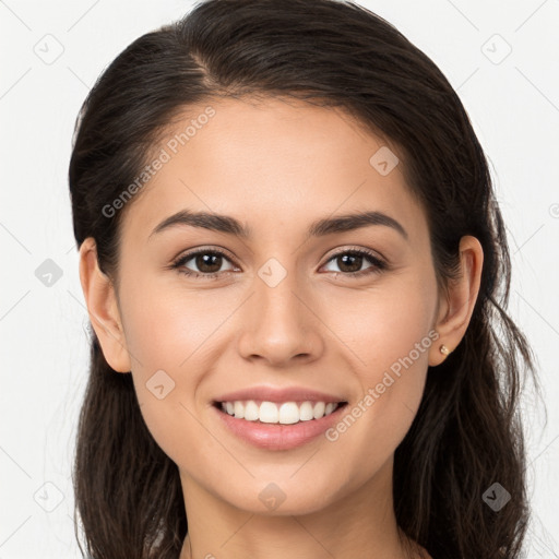 Joyful white young-adult female with long  brown hair and brown eyes