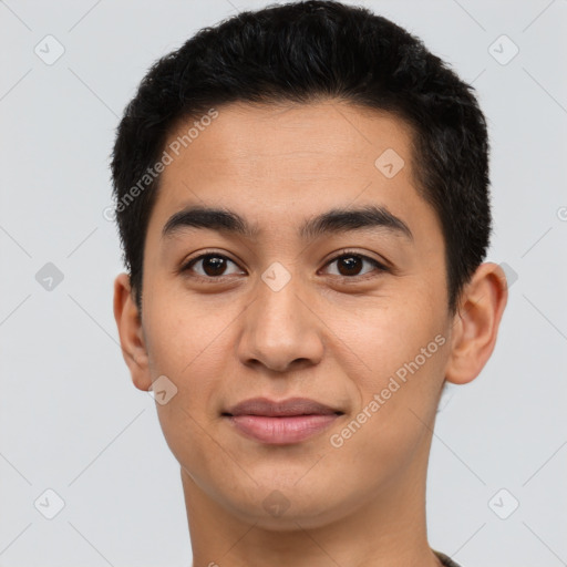 Joyful latino young-adult male with short  brown hair and brown eyes