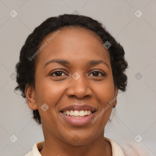 Joyful black young-adult female with medium  brown hair and brown eyes