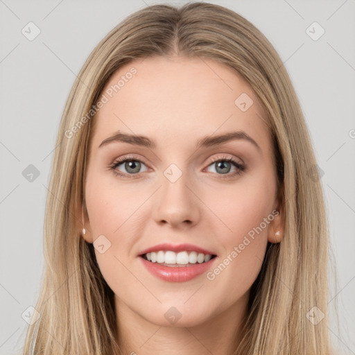 Joyful white young-adult female with long  brown hair and grey eyes