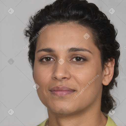 Joyful latino young-adult female with short  black hair and brown eyes