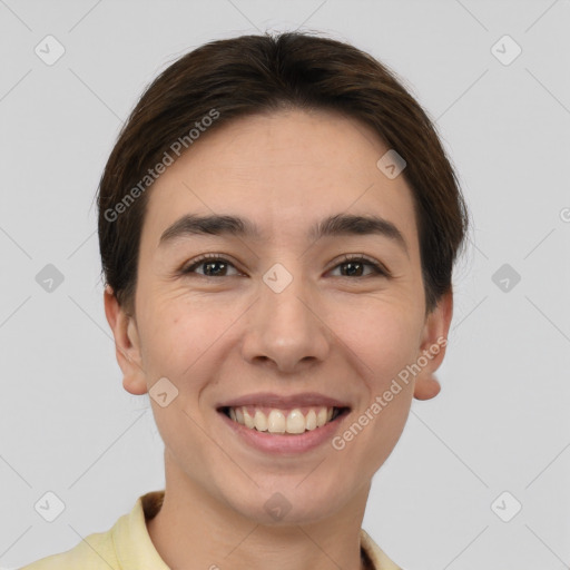 Joyful white young-adult female with short  brown hair and brown eyes