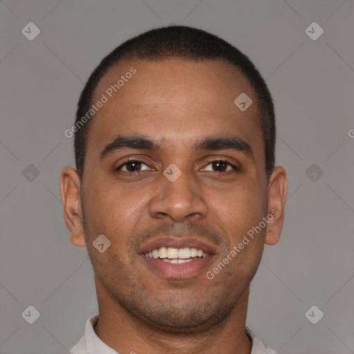 Joyful black young-adult male with short  brown hair and brown eyes