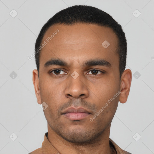 Neutral latino young-adult male with short  black hair and brown eyes