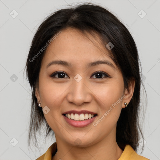 Joyful asian young-adult female with medium  brown hair and brown eyes