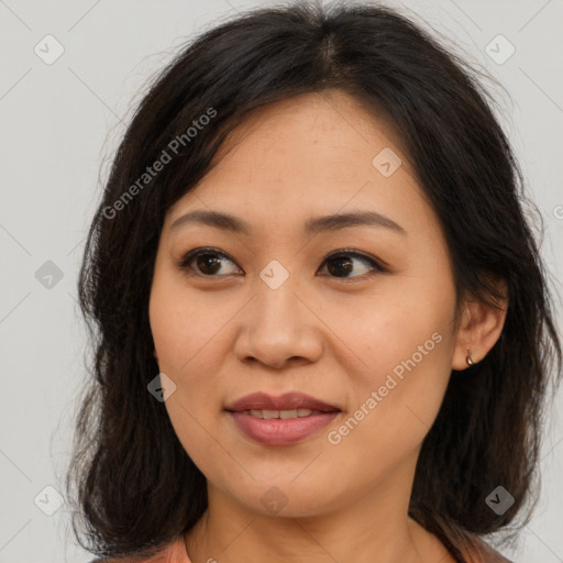 Joyful asian young-adult female with long  brown hair and brown eyes