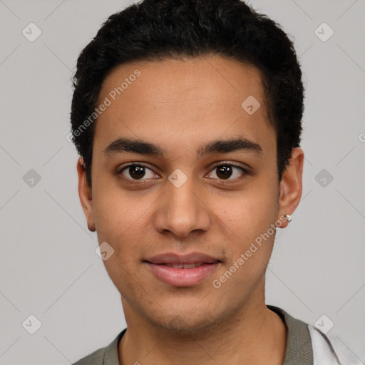 Joyful latino young-adult male with short  black hair and brown eyes