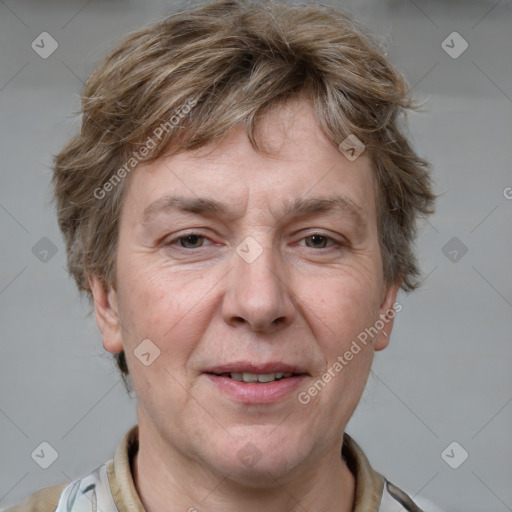 Joyful white adult male with short  brown hair and grey eyes