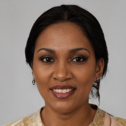 Joyful black young-adult female with medium  black hair and brown eyes