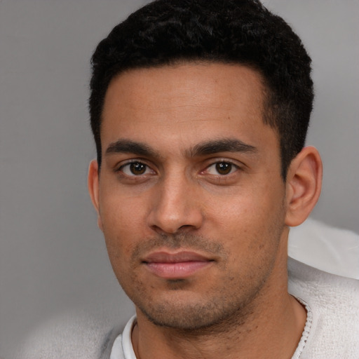 Neutral white young-adult male with short  black hair and brown eyes